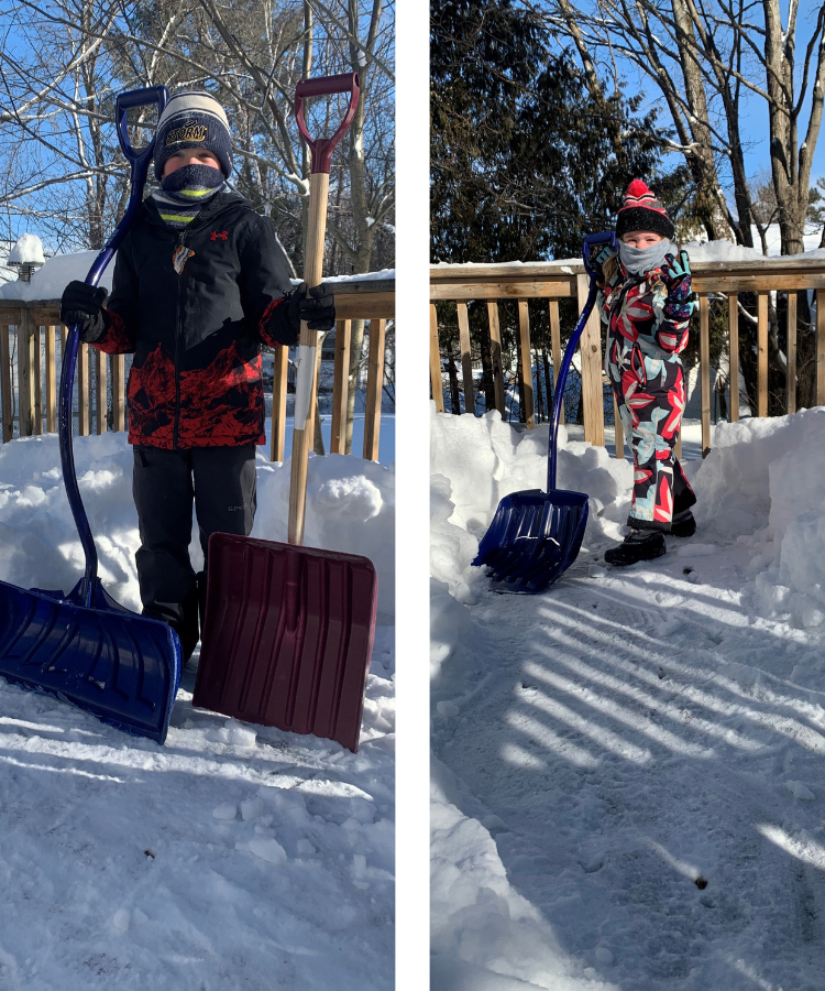 Two kids shoveling snow